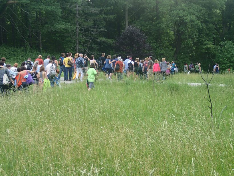 The audience moves between scenes.