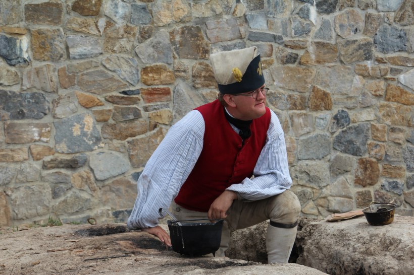 Making bread in ovens dug into the clay.