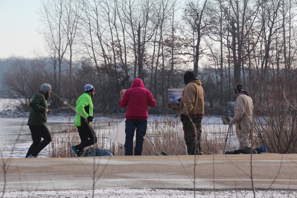 Painters and runners share space.