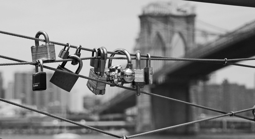 Locks on a pier in Brooklyn NY, near the Brooklyn Bridge.
