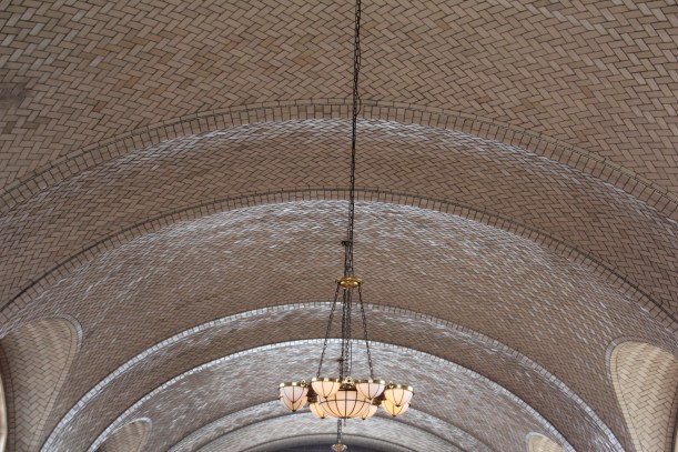 Notice the beautiful tiled arches. And the original fixture.