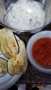 Broil the egplant, puree the tomatoes.  Lick the spoon on the ricotta cheese.
