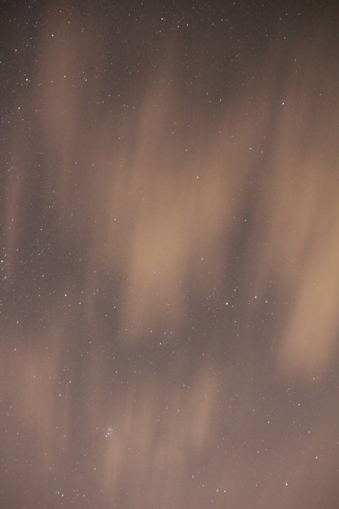 High thin clouds obscure the stars.